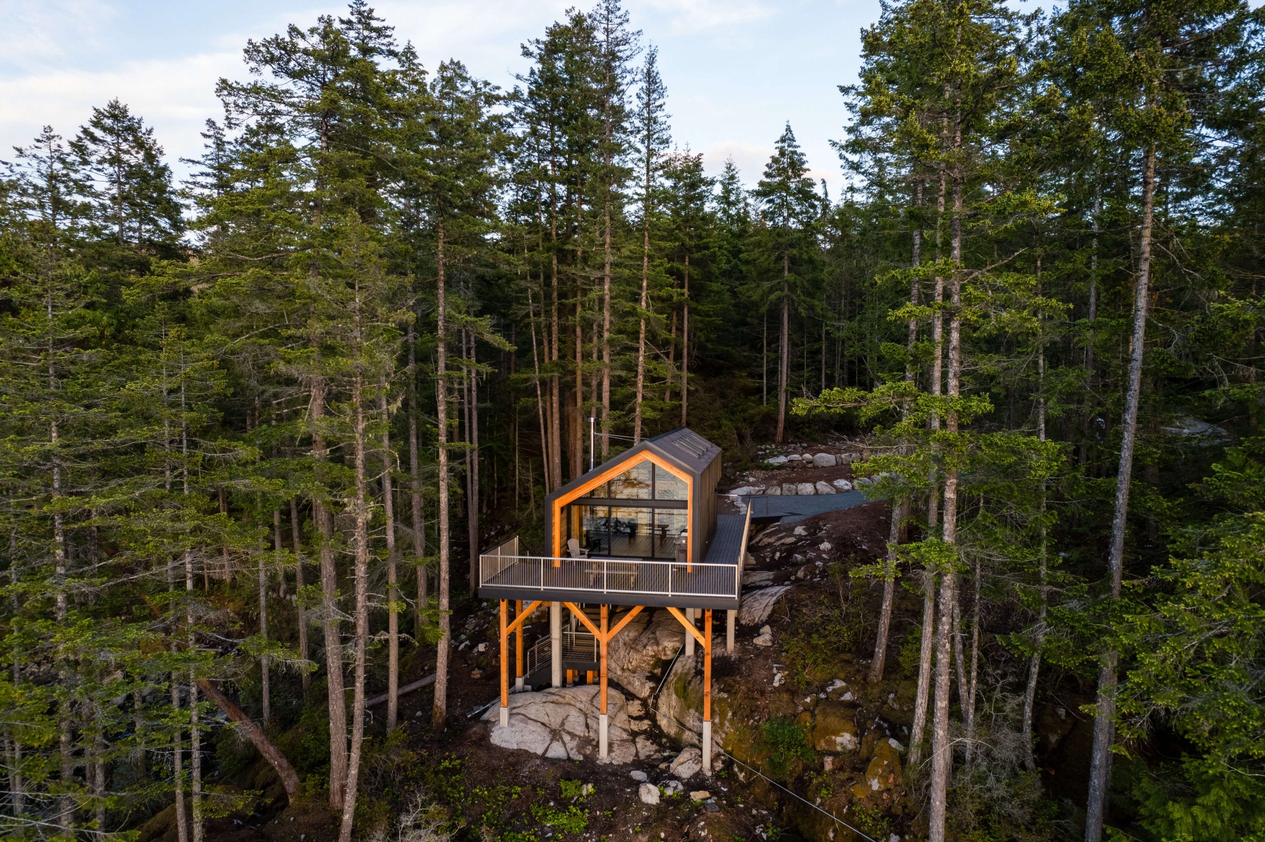 Blue Water’s Hardy Island family retreat, set into a rocky forested site.