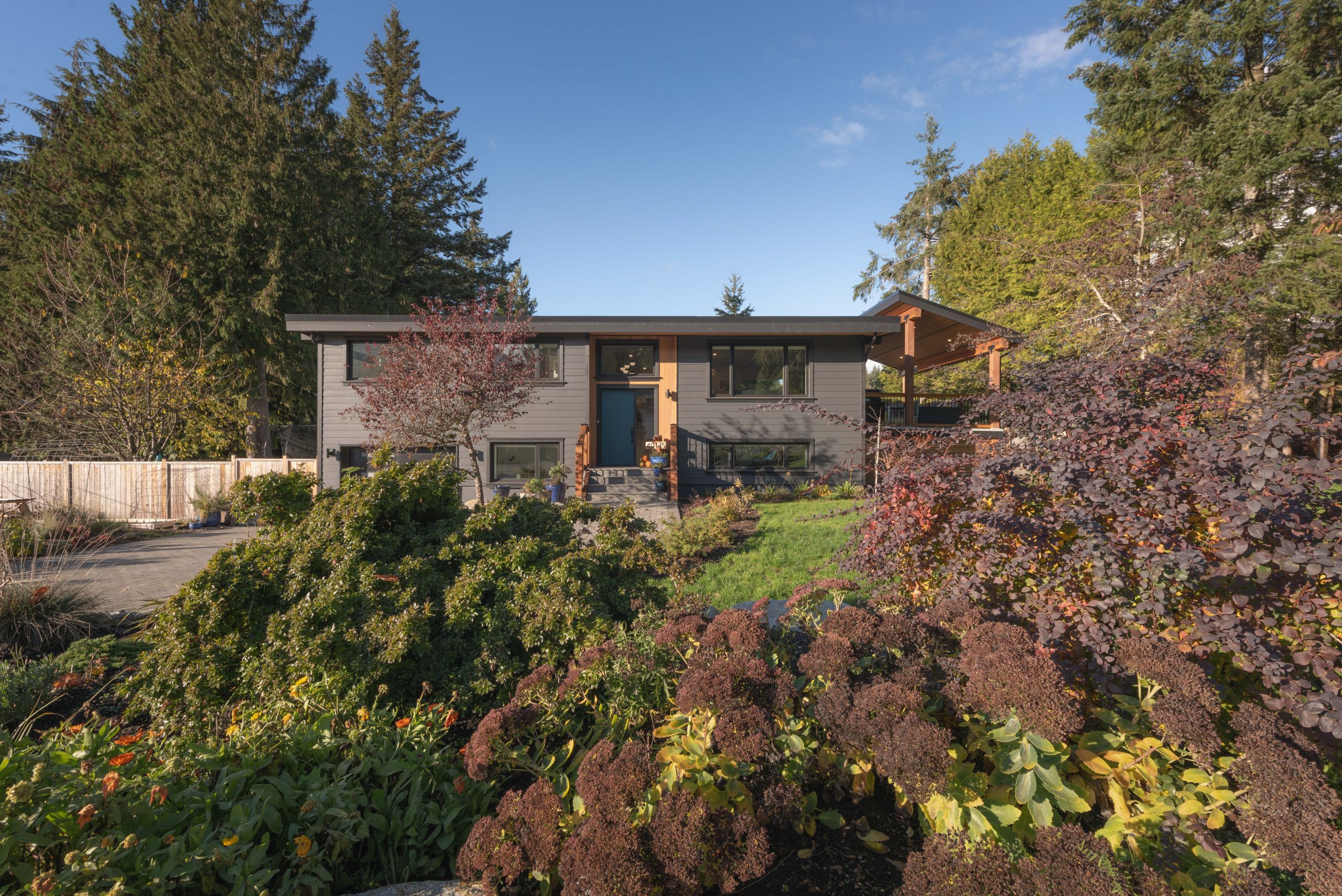 Kintyre whole-home renovation set among trees and landscaped grounds in Squamish.